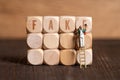 Little painter figure and cubes with the word FAKE