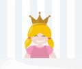 Little pampered blond princess with golden crown