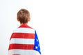 Little patriot with American flag, back view. Happy child holds a flag of America. Independence Day concept