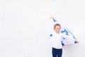 Little patriot jewish girl with flag Israel on white background.