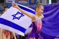 Little patriot jewish girl standing and enjoying with the flag of Israel