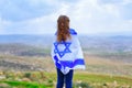 Israeli jewish little girl with Israel flag back view. Royalty Free Stock Photo