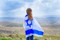 Israeli jewish little girl with Israel flag back view. Royalty Free Stock Photo