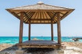 Little pavilion with clear blue sea and blue sky