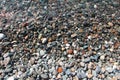 Little pebbles under the water surface photo background summer sea