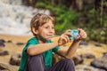 Little photographer taking picture with toy camera Royalty Free Stock Photo