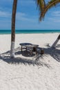 Little picnic table and chairs on paradise Remote beach cabo catoche with turquoise water in holbox mexico