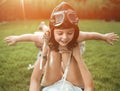 Little pilot - girl having fun with a young mom Royalty Free Stock Photo