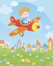 Little pilot in his plane over a town Royalty Free Stock Photo