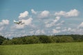 Little plane approaching and the green german countryside