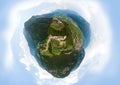 Little planet aerial view of Beseno Castle and northern vineyards, the largest fortified structure in Besenello, Trento, Italy.