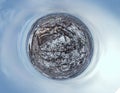 Little planet aerial view of Mukachevo with the Palanok Castle in Zakarpattia, Ukraine. Roofs covered with snow, winter view of Royalty Free Stock Photo