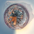 Little planet 360 degree sphere. Petropavlovsk-Kamchatsky cityscape. Sunrise over Koryaksky and Avachinsky volcanoes