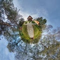 Little planet. Spherical aerial view in forest near vacation home in nice day with nice clouds Royalty Free Stock Photo