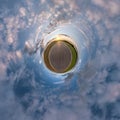Little planet. Spherical aerial 360 view panorama on asphalt road among fields in summer evening sunset with awesome clouds Royalty Free Stock Photo