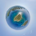 Little planet - spherical view above small island near the sea shore. 360 Drone aerial tiny planet