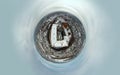 Little planet top down aerial view of Mukachevo with the Palanok Castle in Zakarpattia, Ukraine. Roofs covered with snow, winter Royalty Free Stock Photo
