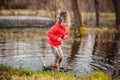 Charming girl playing in puddle Royalty Free Stock Photo