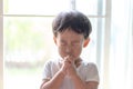 A little prayer, A boy is praying seriously and hopefully to Jesus