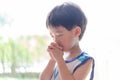 A little prayer, A boy is praying seriously and hopefully to Jesus