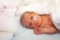 Portrait of a baby boy in ICU hospital crib Royalty Free Stock Photo