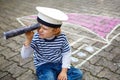 Little preschool child having fun with ship picture drawing with Royalty Free Stock Photo