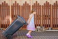 Little preschool girl with glasses taking garbage can. child learning waste sorting. Environment concept Royalty Free Stock Photo