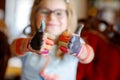 Little preschool girl painting with felt pens on hands. Creative cute child showing hands and arms painted with colorful pens or Royalty Free Stock Photo