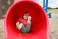 Little preschool girl playing on outdoor playground. Happy toddler child climbing and having fun with summer outdoors Royalty Free Stock Photo