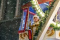 Little preschool girl riding on ferris wheel carousel horse at Christmas funfair or market, outdoors. Happy toddler Royalty Free Stock Photo