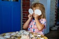 Little preschool girl with variation of different shells and clams at home. Happy child with collected shell from