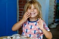 Little preschool girl with variation of different shells and clams at home. Happy child with collected shell from