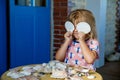 Little preschool girl with variation of different shells and clams at home. Happy child with collected shell from