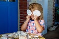 Little preschool girl with variation of different shells and clams at home. Happy child with collected shell from