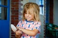 Little preschool girl with variation of different shells and clams at home. Happy child with collected shell from