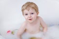 Little preschool kid boy riding with his first green bike Royalty Free Stock Photo