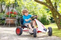 Little preschool kid boy riding with his first green bike Royalty Free Stock Photo