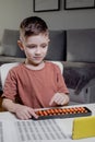 Little preschooler counting large numbers on his fingers using mental arithmetic, concept of child development Royalty Free Stock Photo