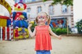 Little preschooler girl with butterfly face painting outdoors Royalty Free Stock Photo