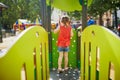 Little preschooler girl with butterfly face painting outdoors Royalty Free Stock Photo