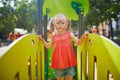 Little preschooler girl with butterfly face painting outdoors Royalty Free Stock Photo