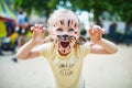 Little preschooler girl with tiger face painting outdoors Royalty Free Stock Photo