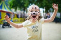 Little preschooler girl with tiger face painting outdoors Royalty Free Stock Photo