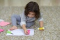 Little preschooler toddler girl gluing colorful paper. Royalty Free Stock Photo