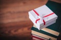 Little present box on top of books Royalty Free Stock Photo