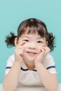 Little pretty Asian girl laughing portrait with milk and bread, healthy and happy lifestyle Royalty Free Stock Photo