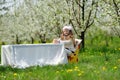 Little pretty girl in the green garden Royalty Free Stock Photo