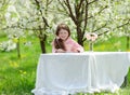 Little pretty girl in the green garden Royalty Free Stock Photo