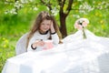 Little pretty girl in the green garden Royalty Free Stock Photo