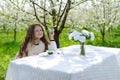 Little pretty girl in the green garden Royalty Free Stock Photo